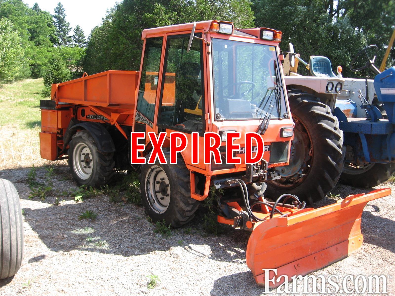 Holder C9700H sidewalk machine, sander with hyd dump, front blade for